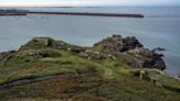 This quiet British island was once the site of Nazi atrocities. A new inquiry reveals its truths
