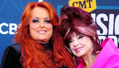 Wynonna Judd says she still talks to late mother Naomi when she performs: 'Why are we not singing together?'