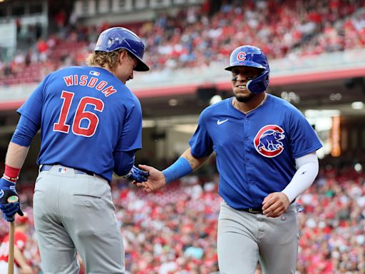 Happ launches 2-run homer and Cubs pound out 17 hits in 13-4 rout of Reds