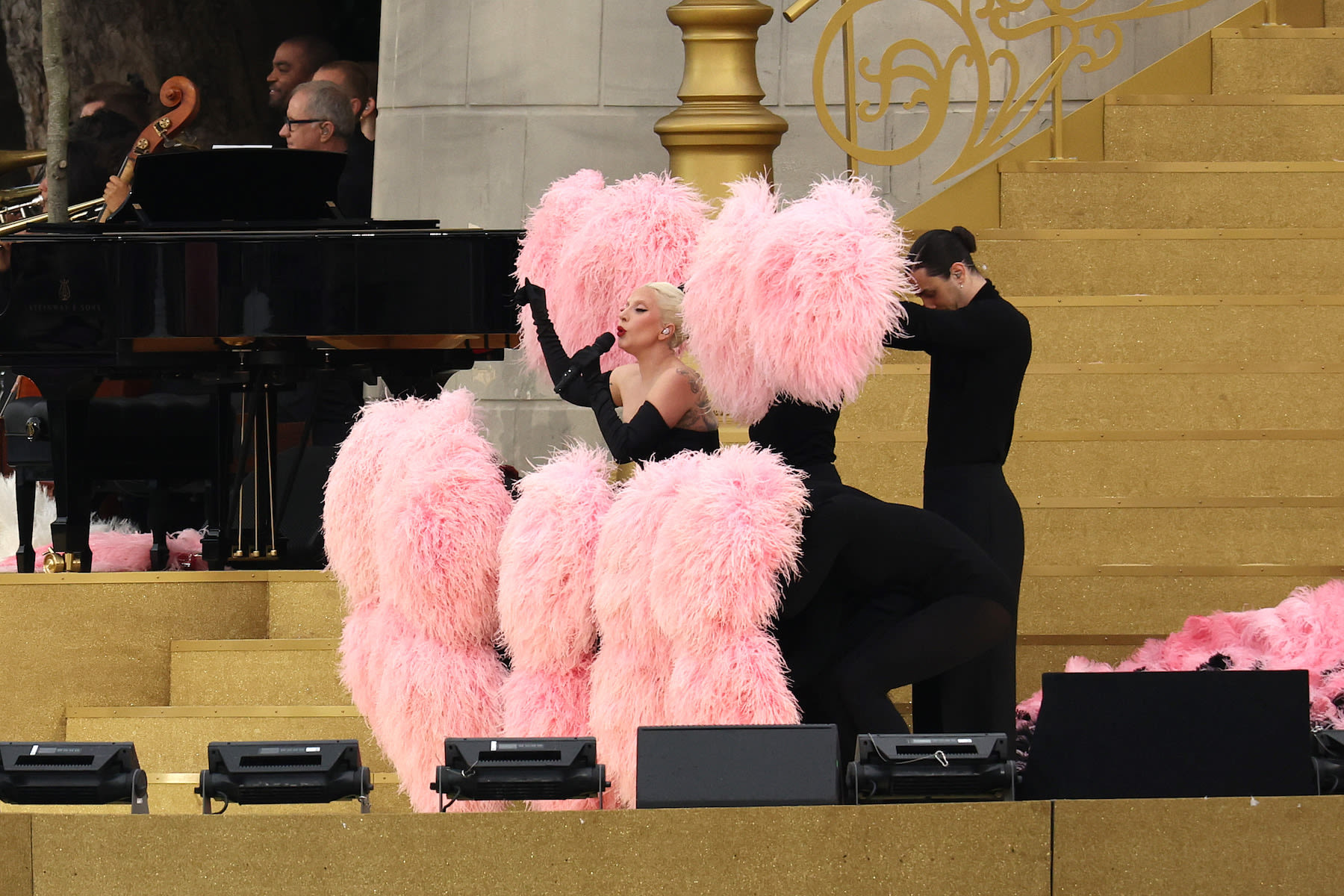 Lady Gaga Sings in French, Bustles With Feathers at Olympics Opening Ceremony Performance