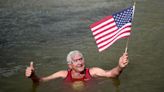 An American swims in Paris' Seine River before the Olympics despite contamination concerns