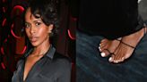 Sabrina Elba Relaxes in Black Braided Sandal Shoe at Naomi Campbell’s A Midsummer Night Event