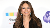 Elizabeth Hurley Sets Pulses Racing in Black Bikini With Risqué Beach Cover-Up