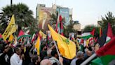 Iran’s supreme leader prays over coffin of Hamas leader