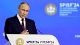 Putin says Russia's economy is growing despite heavy international sanctions as he courts investors