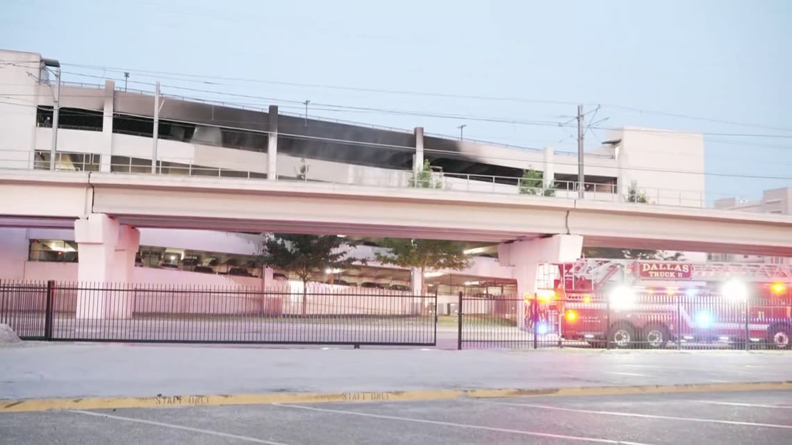 8 cars burned, 13 others damaged in Dallas parking garage fire, officials say