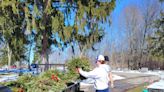 Hillsdale Wreaths Across America and Hillsdale College football unite to retire wreaths