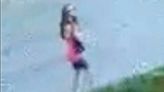Surveillance footage shows girl walking down street before vanishing