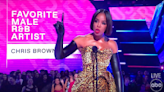 Kelly Rowland defends Chris Brown, tells booing crowd to 'chill out' at AMAs ceremony