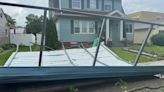 Bolted carport lands in neighbor's yard after storm sweeps through Western PA