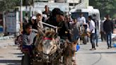 Weary families trudge through Gaza streets, trying to flee the north before Israel's invasion