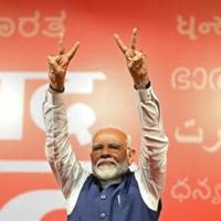 India’s Prime Minister Narendra Modi celebrates after his election win on Tuesday