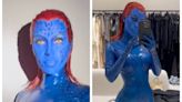 Kim Kardashian morphs into X-Men's Mystique with a daring blue catsuit and matching face paint for Halloween