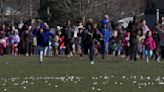 Children race to collect marshmallows dropped from a helicopter at a Detroit-area park