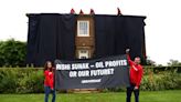 Activists turn U.K. leader's home black to protest oil "drilling frenzy"