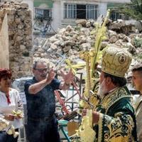 ...fronds to bless worshippers from Gaza's Christian minority in a procession during the Palm Sunday service to mark the start of Holy Week for Orthodox Christians, in Gaza City