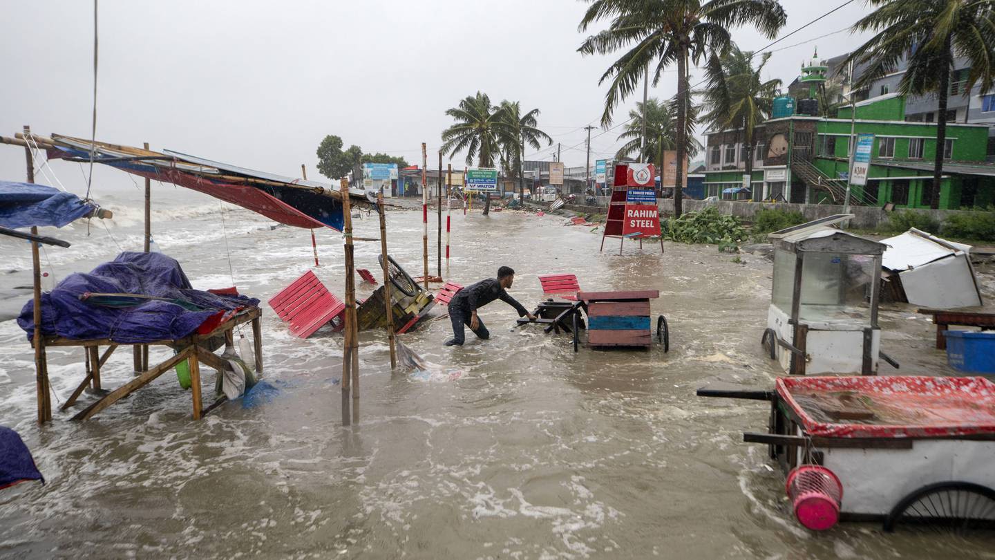 Cyclone floods coastal villages and cuts power in Bangladesh, where 800,000 had evacuated