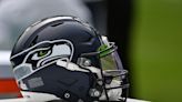 Three Seahawks defenders attempted to draw the team logo