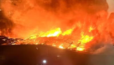 Huge blaze rips through building as residents urged 'close windows'