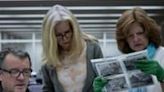 French researcher and documentary maker Dominique Forget (L) looks at prints made from the war images of Richard Taylor with the sergeant's daughters, Jennifer Taylor-Rossel (C...