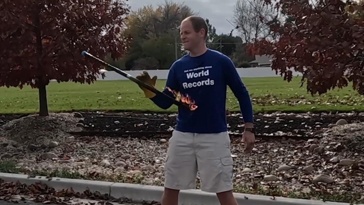 Man spins fire sword 73 times in 30 seconds, captures 166th world record