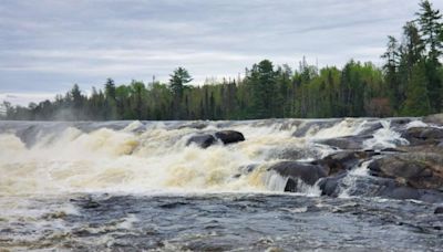 Two missing after canoes go over Minnesota waterfall as harsh weather hinders search