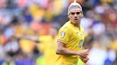 Fans left baffled as Romania star Ianis Hagi wears NETTING on his head