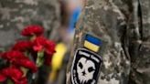 A "Ghost of Kyiv" patch is seen on the uniform of a Ukranian serviceman