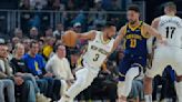 CJ McCollum scores 28 points as Pelicans hold off Warriors 114-109 to help playoff position