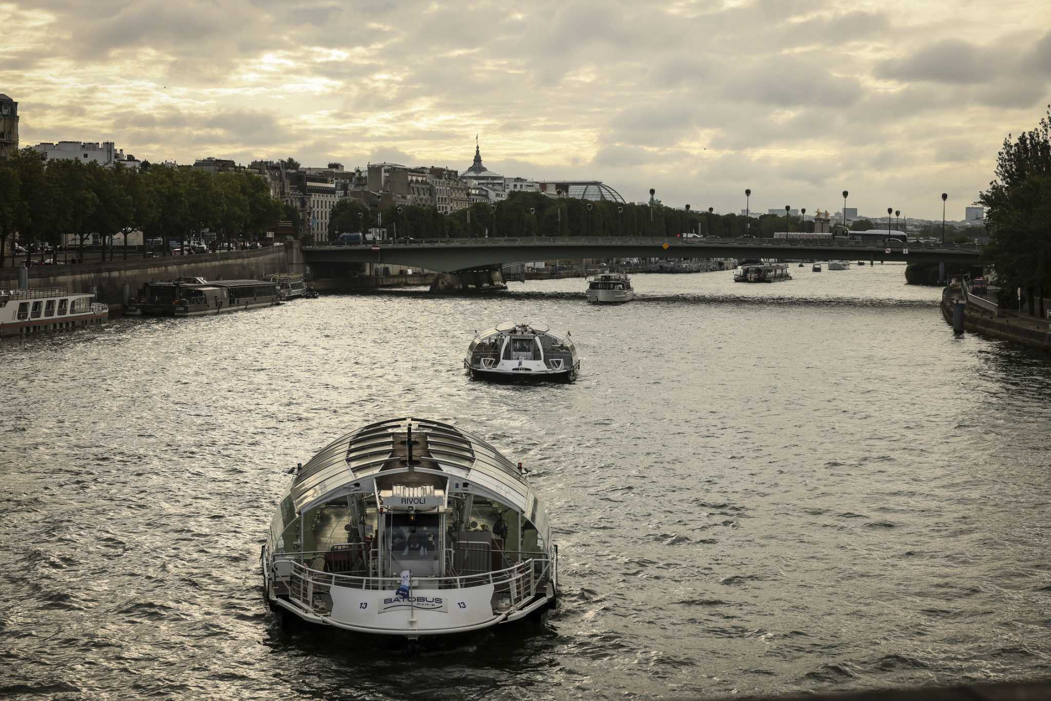 Boats cruise the Seine river in a rehearsal for the Paris Olympics’ opening ceremony