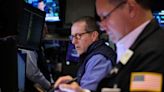 Wall St slips as Treasury yields rise, oil prices boost energy sector