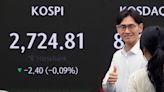 Stock market today: Asian shares mixed in muted trading after Wall Street barely budges