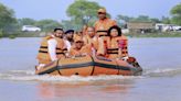 CM Yogi visits flood-hit areas of Pilibhit, Lakhimpur on lifeboat, meets victims | VIDEO