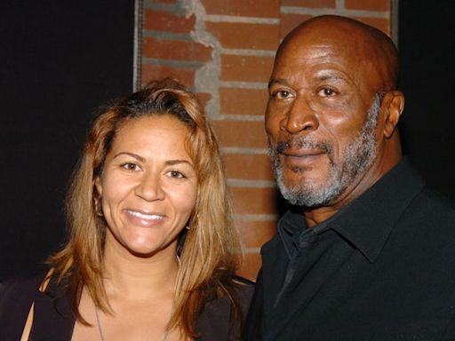 Shannon Amos says she learned about father John Amos’ death “through the media”