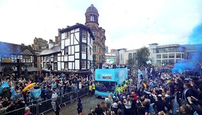 Joyous scenes as thousands of Man City fans flood streets for victory parade