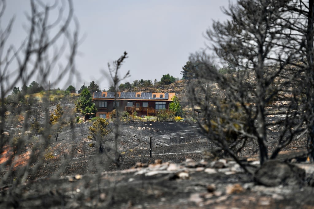 After a week of destructive Colorado wildfires, crews make progress toward containment