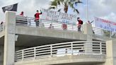 Four charged under new hate crimes law with placing swastika banners over I-4 in Orlando