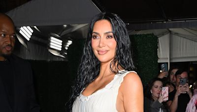 Kim Kardashian Shares Selfies in Vinyl Plunging Top