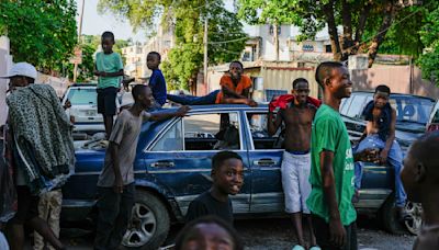AP PHOTOS: In documenting violence in Haiti, you find bodies, but also ways people keep on living