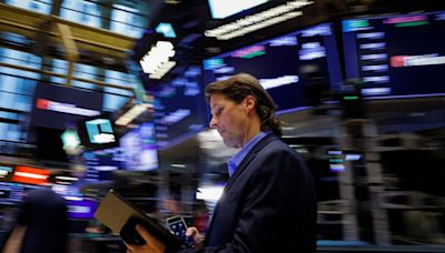 Dow closes at record high as tame inflation report also lifts small caps