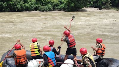 11 bodies recovered after landslide sweeps two buses into river