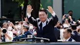 New South Korea leader takes oath, hints at bid to lure Kim back to talks