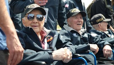 French children hail D-Day veterans as heroes as they arrive in Normandy for anniversary events