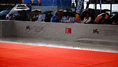 Rainstorm sends stars fleeing Venice red carpet