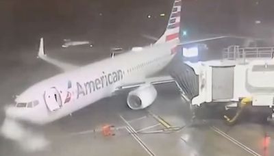 American Airlines Boeing 737 plane blown across the tarmac in Dallas