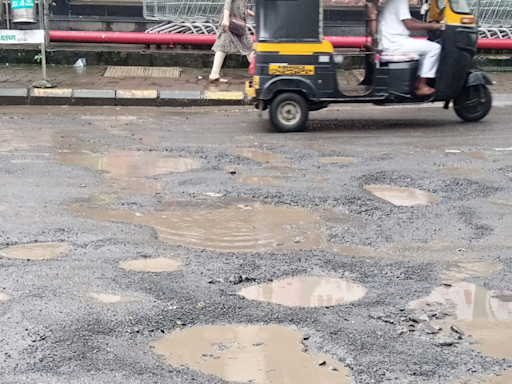 Activists demand action against contractor after potholes appear on road repaired for Rs 3 crore | Navi Mumbai News - Times of India