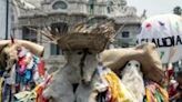 Supporters of ruling-party presidential candidate Claudia Sheinbaum wearing traditional costumes head to her campaign finale in Mexico City