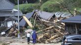 A strong tropical storm lashes parts of Japan and disrupts holiday travel