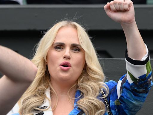 Rebel Wilson shows off her ample cleavage in a smart suit at Wimbledon