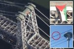 Large Palestinian flag unfurled on Williamsburg Bridge during rush hour